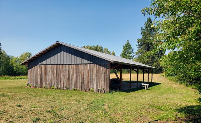Weathered silver barn siding under a standing-seam roof